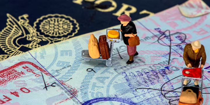 stamped passport with plastic figures on top