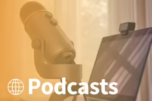 microphone connected to a laptop in front of a window. text podcasts