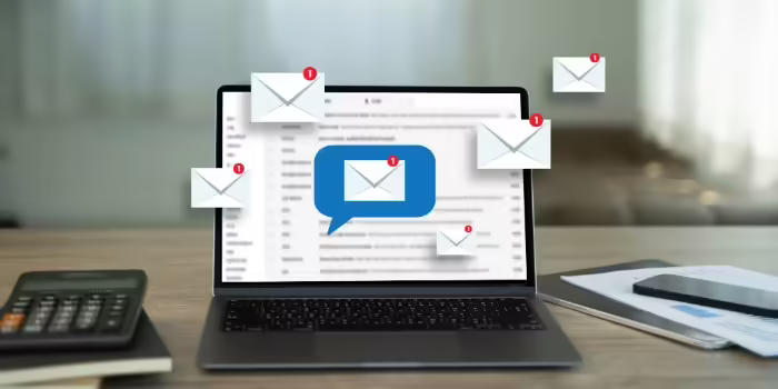 email inbox with multiple envelope icons on open laptop