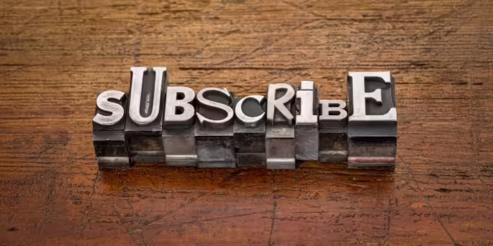 subscribe spelled out in letterpress letters 