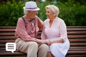 older couple sitting on bench