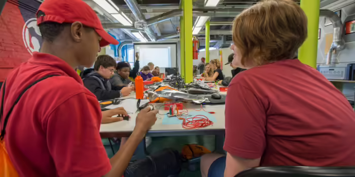 youth learning robotos and STEM skills