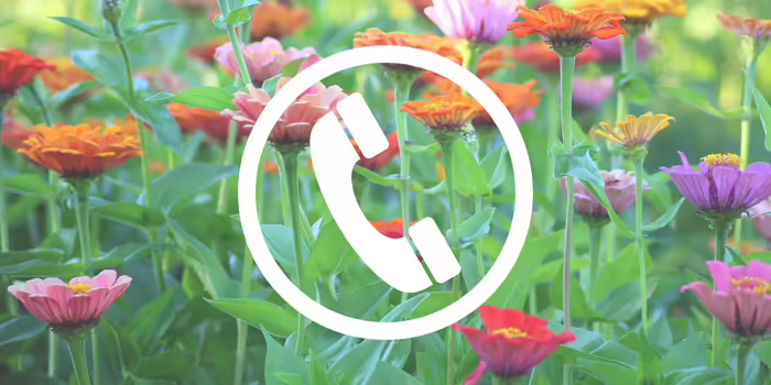 telephone icon in front of colorful flowers