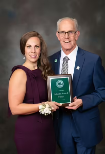 Munro receiving plaque award