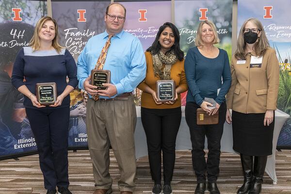 Four horticulture educators with award plaques with Dr. Nickols-Richardson