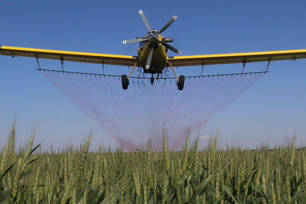 plane spraying herbicide