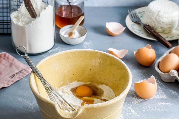 mixing bowl with eggs and flour food safety