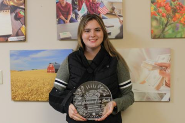 libby larkin holds food advocate award