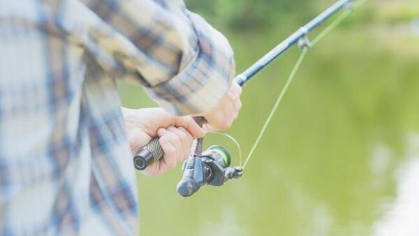 Person using a fishing pole