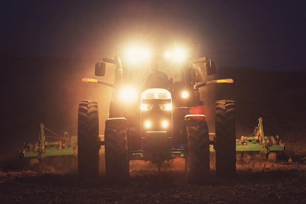 tractor in field at night