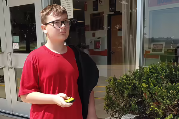 youth in red shirt 