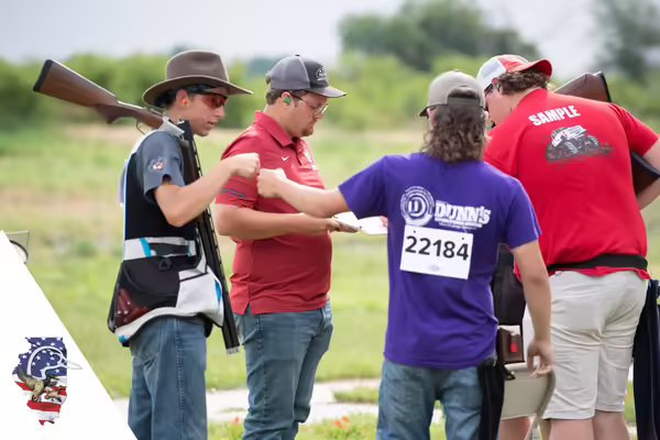 youth fist bumping another at a competition