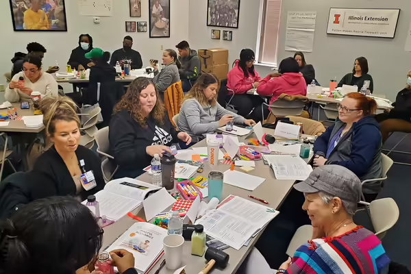afterschool educators working around the tables