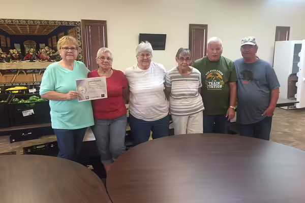 six volunteers receiving an award