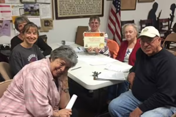 six employees of the food pantry receive an award