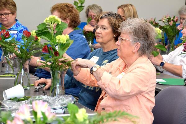 group of ladies learning to do flower arranging
