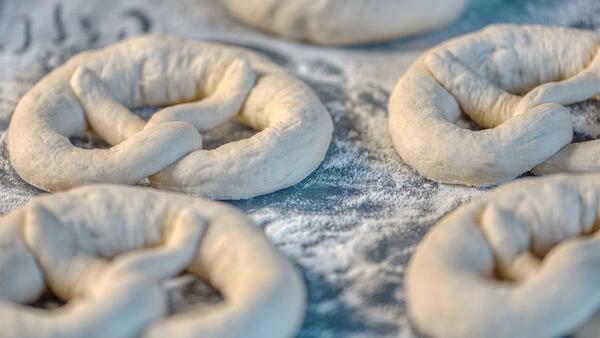 Homemade pretzels in flour