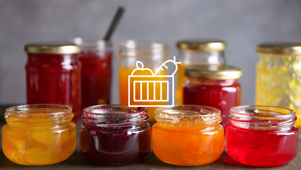Homemade jelly and jam in glass containers.