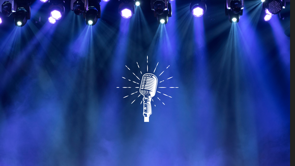 A microphone icon with a background of a stage.