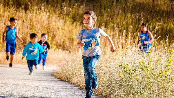 Children running on a path in nature