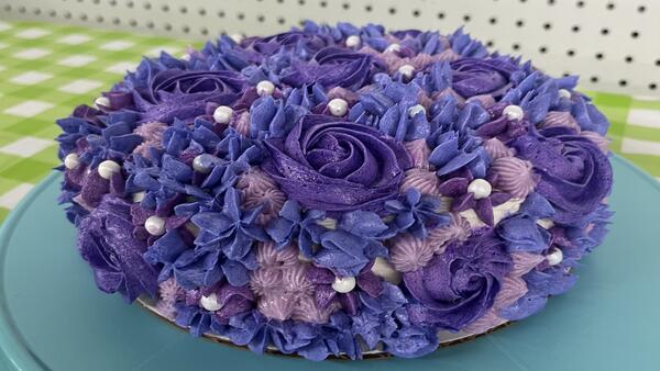 cake with purple flower decorations