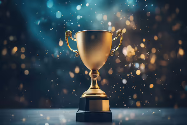 Gold Trophy with golden accents in background