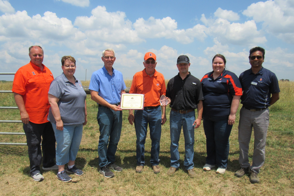 Pictured are (left to right) Carl Baker, government relations assistant director, Illinois Extension; Janice McCoy, assistant director, Region 2, Illinois Extension; State Representative Brad Halbrook; Ed Ballard, Dudley Smith Farm coordinator; Dan Shike, professor and interim head, University of Illinois Department of Animal Sciences; Sara Marten, county director, Illinois Extension; and Shibu Kar, assistant dean and program leader for natural resources, environment, and energy, Illinois Extension.
