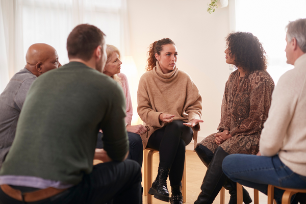 A group of diverse people in a therapy