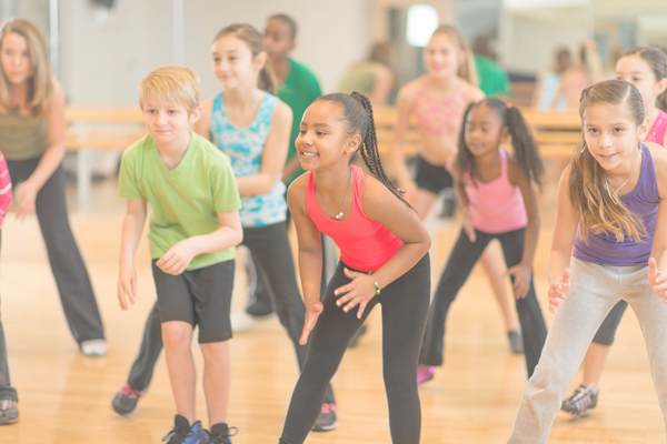 kids dancing in a gym