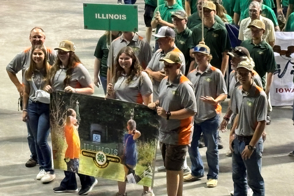4-H team carries a banner to competition.