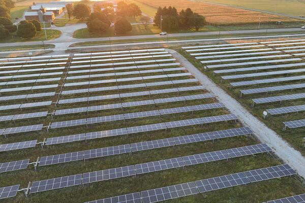 Overhead view of farmland filled with solar panels. 