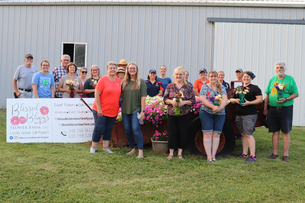Participants display their handpicked bouquets from Blessed Blooms following an on-site visit during the Southern Illinois Summer Twilight Series.