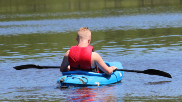 Boy in a kayak.