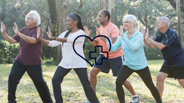 Group of people doing Tai Chi with heart and health graphic.