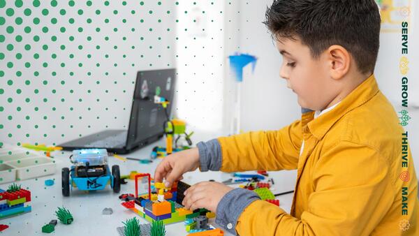 boy playing with legos