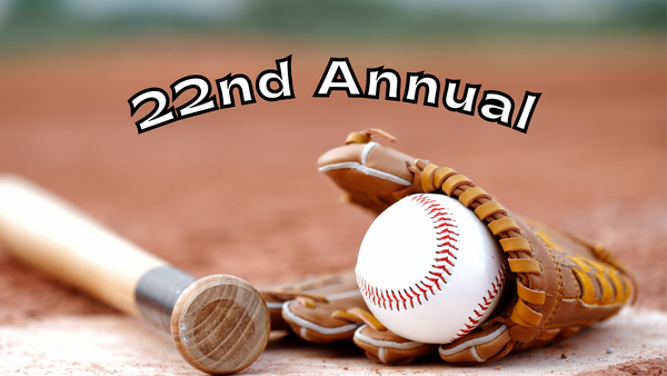 A baseball inside a glove and a bat on a field. There is overlay text that reads 22nd Annual.