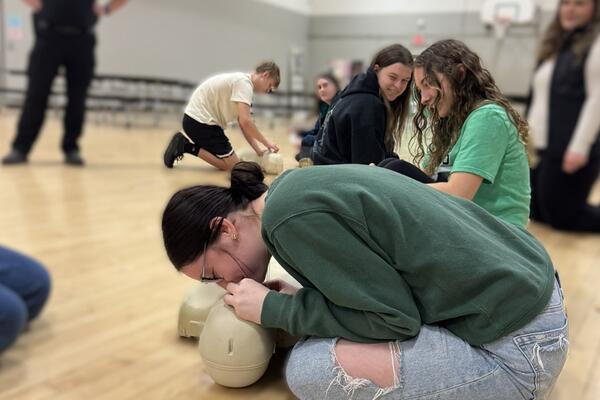 girl practicing cpr