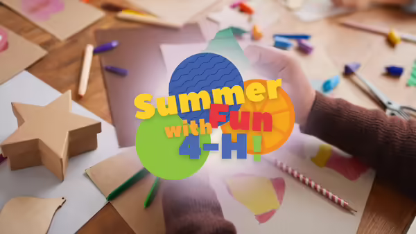 "Summer Fun with 4-H!" in front of craft supplies
