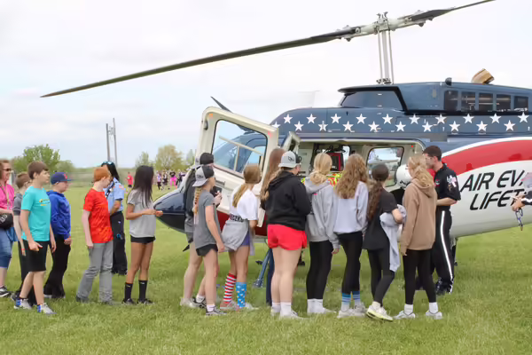 Sixth grade students get an up close look at Air Evac during the Ride Right Rally.