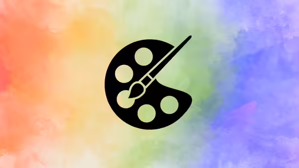 A watercolor rainbow with a paint palette and brush in middle of image.