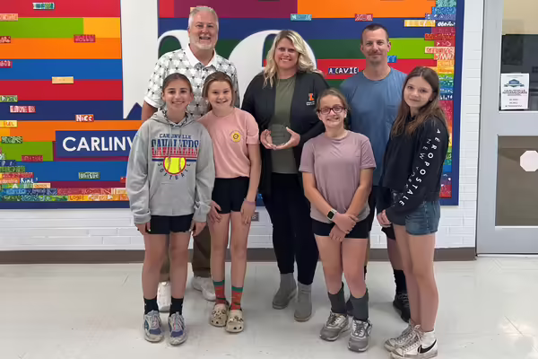 Back row (left to right) Principal Roy Kulenkamp, Kate Harding, and PE Teacher Tim Johnson. Front row (left to right): Emelia Daggett, Eva Heller, Lillian Dickison, and Phoebe Foiles