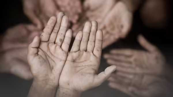 Dirty hands being held out.