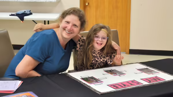 a girl pictured with the 4-H clothing judge