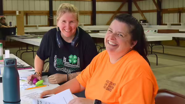 two women smiling at the camera