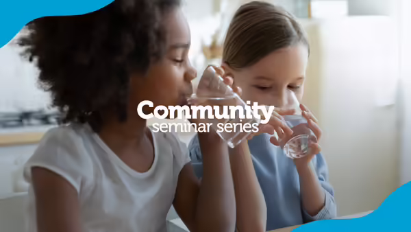 Two girls drinking water