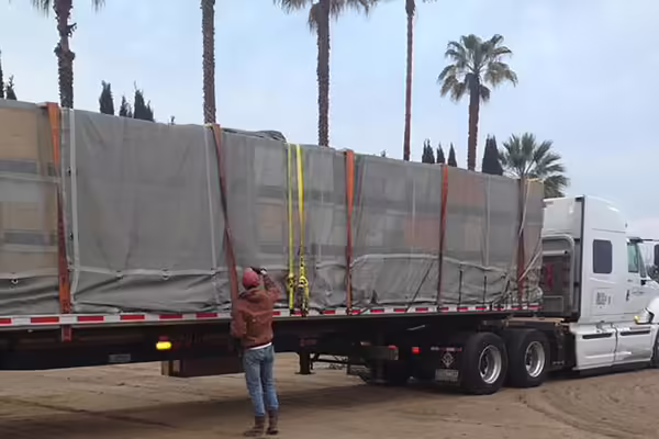a man checks a semi truck load