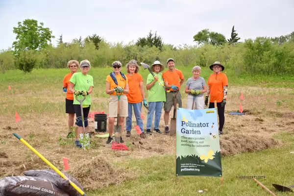 Group of people setting up a pollinator garden