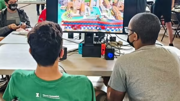 Youth compete at a table for eSports.