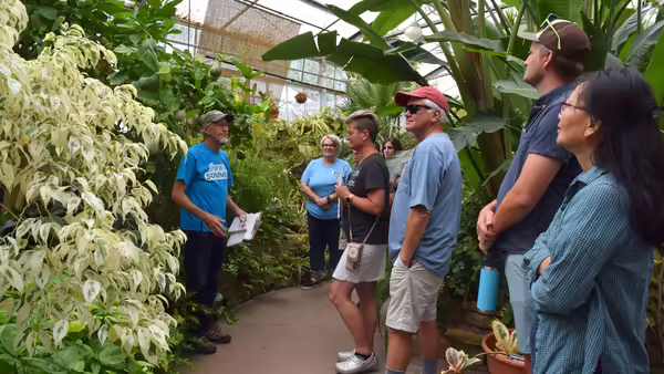 group of people in a plant conservancy