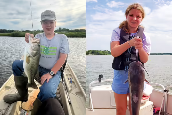 Winners pose with fish.